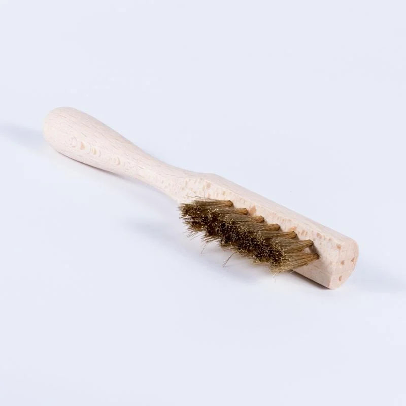 small brass-bristled brush